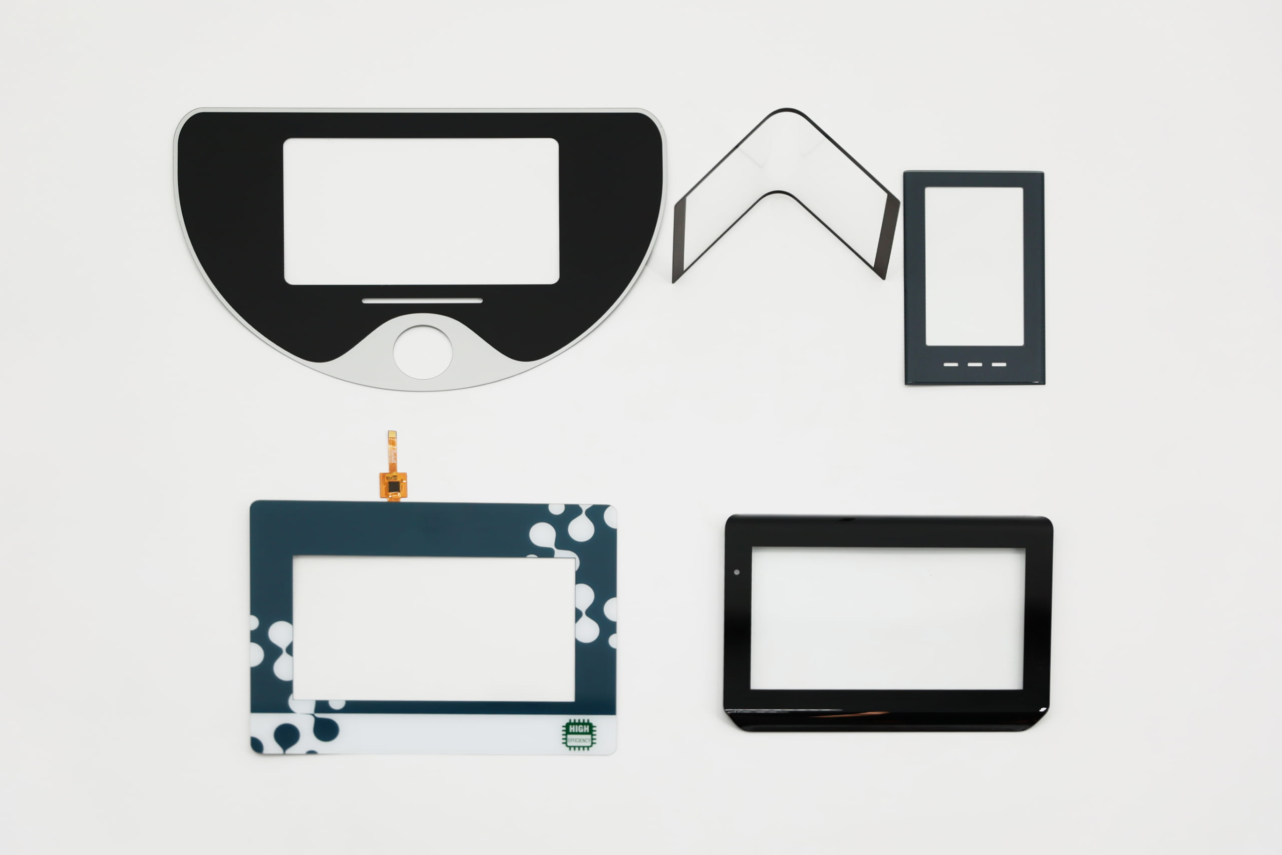 A side-by-side comparison of a rugged resistive touchscreen on a machine and a sleek capacitive touchscreen on a medical device